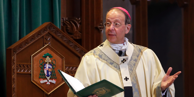 In this March 28, 2017 photo Archbishop William Lori leads a funeral Mass for Cardinal William Keeler at the Cathedral of Mary Our Queen in Baltimore. Lori, of the Diocese of Wheeling-Charleston, announced in a news release Wednesday, Oct. 24, 2018 he plans to release the names of all priests and deacons who have been “credibly accused” of child sexual abuse since 1950. (AP Photo/Patrick Semansky)