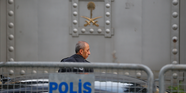A Turkish police officer patrols outside the Saudi Arabia consulate in Istanbul.