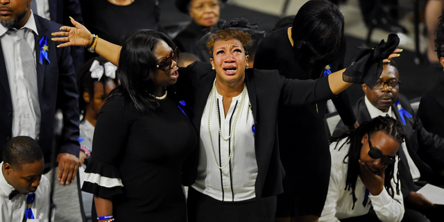 Mourners react during a memorial service for fallen Florence County Sheriff investigator Farrah Turner on Sunday, Oct. 28, 2018, at the Florence Center in Florence, S.C. Turner died from injuries she sustained in the line of duty Oct. 3, 2018. (AP Photo/Richard Shiro)
