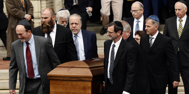 A casket is carried out of Rodef Shalom Congregation after the funeral services for brothers Cecil and David Rosenthal, Tuesday, Oct. 30, in Pittsburgh. The brothers were killed in the mass shooting last week.