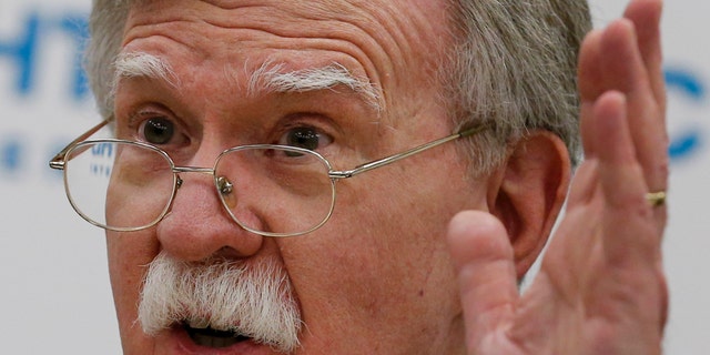 U.S. National security adviser John Bolton gestures as he speaks to the media after his talks with Russian President Vladimir Putin in Moscow, Russia, Tuesday, Oct. 23, 2018. Bolton said that Russia has hurt itself by meddling in the U.S. elections, effectively blocking the prospects for improving U.S.-Russia ties. (AP Photo/Alexander Zemlianichenko)