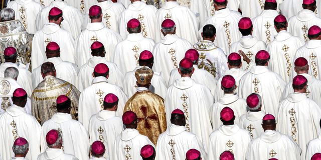 Bishops attend a canonization ceremony in St. Peter's Square at the Vatican, Sunday, Oct. 14, 2018. Pope Francis declared Pope Paul VI and slain Salvadoran Archbishop Oscar Romero saints, reciting in Latin the rite of canonization at the start of Mass in St. Peter's Square. After hearing brief biographies of Paul, Romero and five other people canonized Sunday, Francis declared them saints and "decreed that they are to be venerated as such by the whole church." (Giuseppe Lami/ANSA via AP)