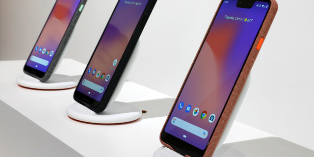 FILE- In this Tuesday, Oct. 9, 2018, file photo New Google Pixel 3 smartphones are displayed in New York. Google’s new Pixel 3 phone plays catch-up with Apple and Samsung on hardware. It’s really designed to showcase Google’s advances in software, particularly in artificial intelligence. (AP Photo/Richard Drew, File)