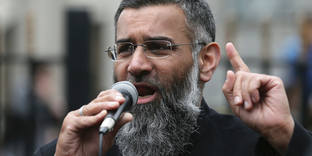 FILE - This is a Friday, April 3, 2015 file photo of Anjem Choudary, a British Muslim social and political activist and spokesman for Islamist group, Islam4UK, speaks following prayers at the Central London Mosque in Regent's Park, London. Anjem Choudary, a radical preacher convicted of inviting support for the Islamic State group, has been released from Belmarsh prison in southeast London on Friday Oct. 19, 2018. (AP Photo/Tim Ireland, File)