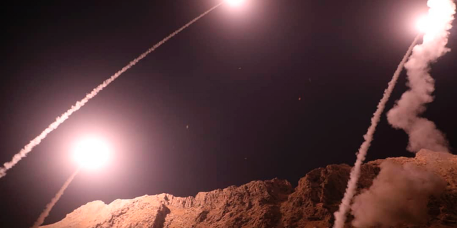Missiles are fired from Kermanshah in western Iran targeting the Islamic State group in Syria, in this photo released by the Iranian Revolutionary Guard, Oct. 1, 2018. (Sepahnews via Associated Press)