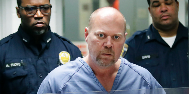 Gregory Bush is arraigned on two counts of murder and 10 counts of wanton endangerment Thursday, Oct. 25, 2018, in Louisville, Ky. Bush fatally shot two African-American customers at a Kroger grocery store Wednesday and was swiftly arrested as he tried to flee, authorities said Thursday. (Scott Utterback /Courier Journal via AP, Pool)