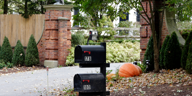 Mailboxes stand outside the entrance to a house owned by philanthropist George Soros in Katonah, N.Y., a suburb of New York City, Tuesday, Oct. 23, 2018. A device found outside the compound "had the components" of a bomb, including explosive powder, a law enforcement official said Tuesday.