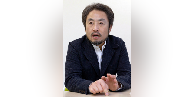 In this photo taken on Feb. 18, 2015, Japanese freelance journalist Jumpei Yasuda speaks during an interview in Tokyo. Japan's government says a man believed to be a Japanese freelance journalist who went missing three years ago while in Syria has been released and is now in Turkey. Chief Cabinet Secretary Yoshihide Suga told a news conference late Tuesday, Oct. 23, 2018 that Japan was informed by Qatar that the man, believed to be Jumpei Yasuda, has been released. (Kyodo News via AP)