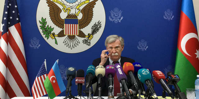 U.S. National security adviser John Bolton adjusts his glasses while speaking to the media after his talks with Azerbaijan's President Ilham Aliyev in Baku, Azerbaijan, Wednesday, Oct. 24, 2018. Bolton said that Washington hasn't yet made up its mind on further sanctions against Russia over the poisoning of an ex-Russian spy in Britain. (AP Photo/Aida Sultanova)