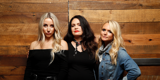 In this Oct. 1, 2018 photo, Ashley Monroe, from left, Angaleena Presley and Miranda Lambert of the Pistol Annies pose for a photo at Sony Nashville in Nashville, Tenn., To promote their newest album, "Interstate Gospel," out on Friday.