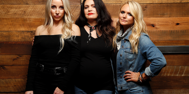 In this Oct. 1, 2018 photo, Ashley Monroe, from left, Angaleena Presley and Miranda Lambert of the Pistol Annies pose for a photo at Sony Nashville in Nashville, Tenn., to promote their newest album, “Interstate Gospel,” out on Friday.