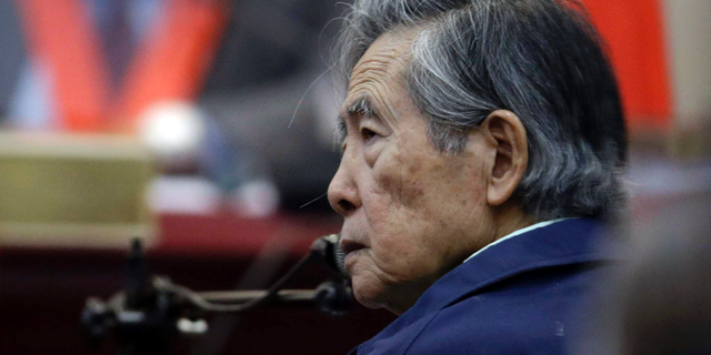 In this March 15, 2018 file photo, Peru's former President Alberto Fujimori listens to a question during his testimony in a courtroom at a military base in Callao, Peru. (AP Photo/Martin Mejia, File)