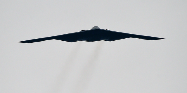 FILE - In this Oct. 25, 2015, file photo, a U.S. Air Force B2 Spirit stealth bomber performs a flyover at the Talladega Superspeedway in Talladega, Ala. The Air Force says a Missouri-based B2 landed in Colorado Springs, Colo., on Tuesday, Oct. 23, 2018, after an unspecified emergency. Neither of the pilots was injured. (AP Photo/Mark Almond, File)