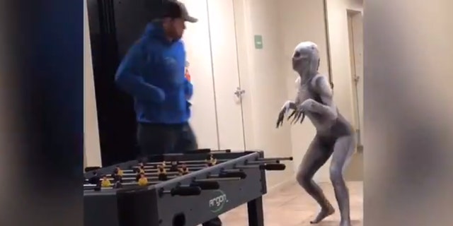 In the footage, Martinez sports a silver-colored, skeletal bodysuit — complete with a spooky mask and extra-long fingers — that zips to conceal her entire frame, as she prances around and scares passersby in the lobby of an apartment building at her college.