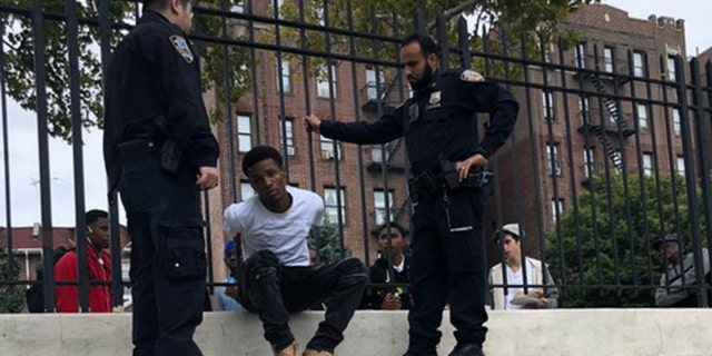 The unidentified teenager is arrested by New York City police after allegedly assaulting a Jewish man in an unprovoked attack.