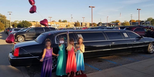 Aliyah Culbert, Hailey Culbert, Alivia Reece and Avery Recee in front of the limousine.