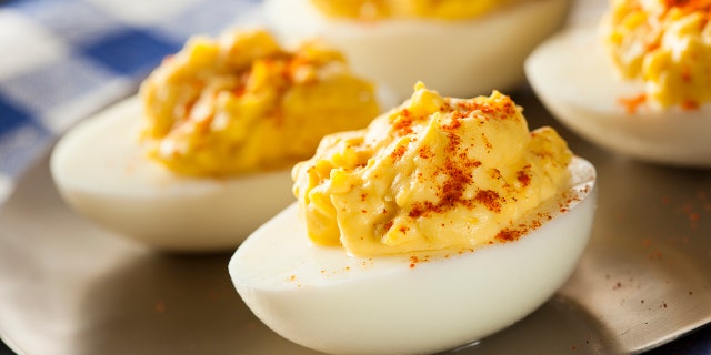 A selection of delicious deviled eggs are shown here — keep this recipe handy for your next gathering or event!