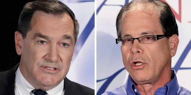 FILE - This combination of Oct. 8, 2018, file photos show Indiana U.S. Senate candidates, Democratic Sen. Joe Donnelly, left, and former Republican state Rep. Mike Braun during a debate in Westville, Ind. (AP Photo/Darron Cummings, File)
