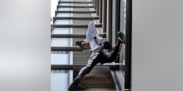 Urban climber dubbed the French Spiderman, Alain Robert scales the outside of Heron Tower building in the City of London.