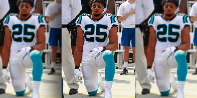 Carolina Panthers' Eric Reid (25) kneels during the national anthem before an NFL football game against the New York Giants in Charlotte, N.C., Sunday, Oct. 7, 2018.