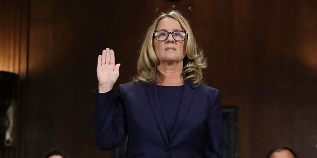 Christine Blasey Ford is sworn in before the Senate Judiciary Committee on Capitol Hill in Washington on Thursday, Sept. 27, 2018.