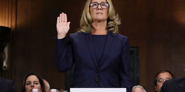 Christine Blasey Ford is sworn in before the Senate Judiciary Committee on Capitol Hill in Washington on Thursday, Sept. 27, 2018.