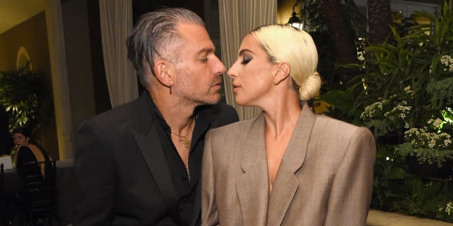 Christian Carino (L) and Lady Gaga attend ELLE's 25th Annual Women In Hollywood Celebration in 2018. 