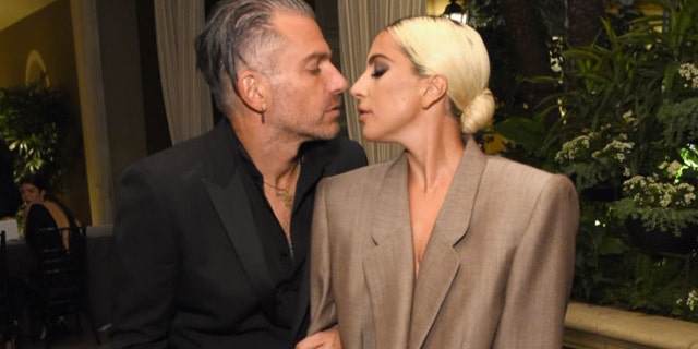 Christian Carino (L) and Lady Gaga attend ELLE's 25th Annual Women In Hollywood Celebration in 2018.
