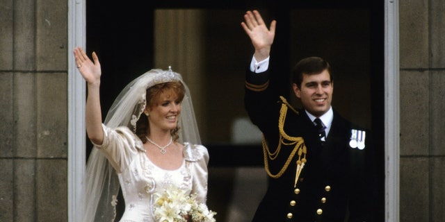 Sarah Ferguson, Duchess of York and Prince Andrew, Duke of York stand on the balcony of Buckingham Palace and wave at their wedding on July 23, 1986 in London, England. They divorced 10 years later.