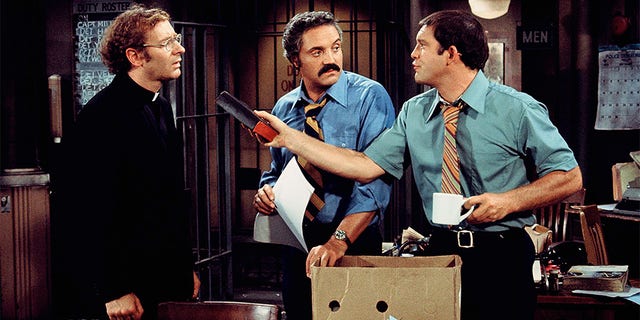Hal Linden (center) starred as Barney Miller.