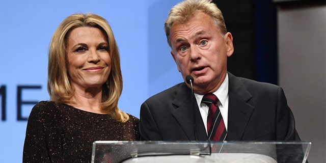 Hosts Vanna White and Pat Sajak.