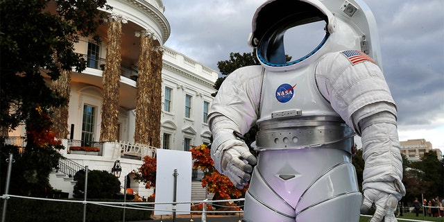 A space suit from NASA on display among the decorations on the South Portico of the White House decorated for Halloween.