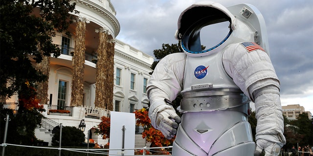A space suit from NASA on display among the decorations on the South Portico of the White House decorated for Halloween.