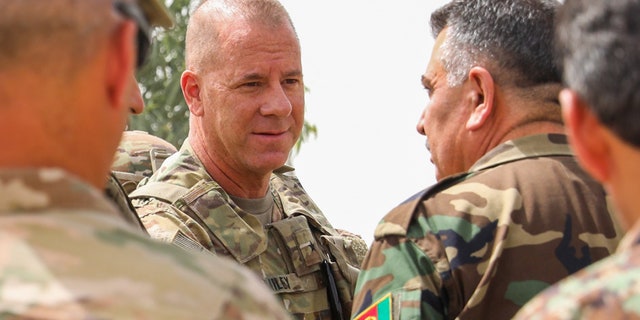 The Pentagon has confirmed that U.S. Army Brig. Gen. Jeffrey Smiley, center, was shot in a Taliban attack that killed two Afghan leaders in Kandahar province last week.