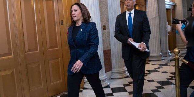 Senate Judiciary Committee members Sen. Kamala Harris, D-Calif., left, and Sen. Cory Booker, D-N.J., arrive at the chamber for the final vote to confirm Supreme Court nominee Brett Kavanaugh, at the Capitol in Washington.