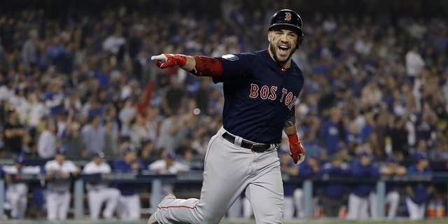 Boston Red Sox's Steve Pearce celebrates his second home run during the eighth inning in Game 5 of the World Series baseball game against the Los Angeles Dodgers on Sunday, Oct. 28, 2018, in Los Angeles.