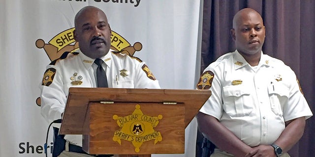 Bolivar County Sheriff Kelvin Williams, left, speaks to reporters at a news conference Tuesday in Shaw, Miss., concerning a 20-month-old girl discovered dead in an oven. Accompanying the sheriff is Chief Deputy Gerald Wesley Jr. (Leah Allen /The Bolivar Commercial via AP)