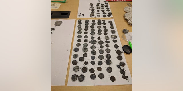 The geyser eruption also revealed coins.