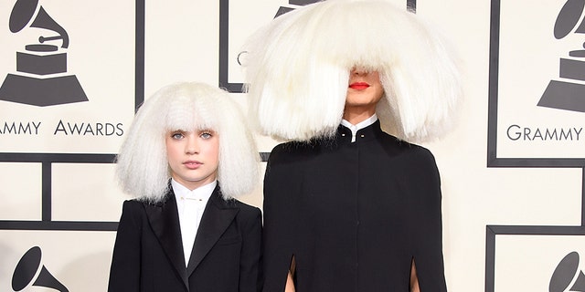 Dancer Maddie Ziegler (L) and singer/songwriter Sia attended the 57th Annual Grammy Awards in 2015. (Photo by Jeff Vespa/WireImage)