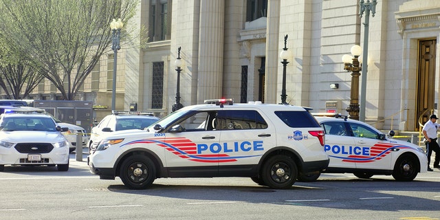 Metropolitan Police Department vehicles close a street in Washington, D.C.