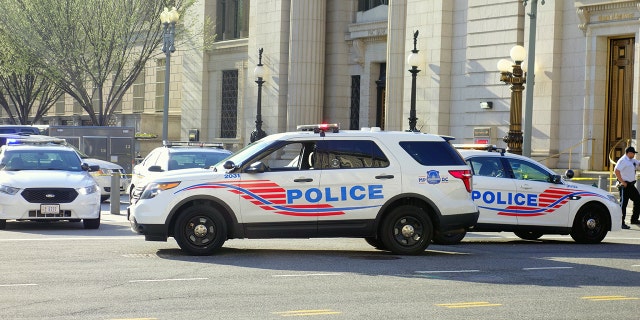 Washington DC, USA - April 12, 2015: Police vehicles stopping the traffic and closing a street in Washington DC (iStock)