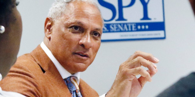 In this Oct. 5, 2018 photograph, Mike Espy, a former congressman and former U.S. agriculture secretary, speaks to college and high school students in a small forum on education in Jackson, Miss. Espy hopes to unseat appointed U.S. Sen. Cindy Hyde-Smith, R-Miss., and serve the last two years of the six-year term vacated when Republican Thad Cochran retired for health reasons. There are two other opponents in the non-partisan race. (AP Photo/Rogelio V. Solis)