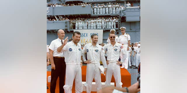 The Apollo 7 crew is welcomed aboard the USS Essex, the prime recovery ship for the mission, on Oct. 22, 1968. Left to right, are astronauts Walter M. Schirra Jr., commander; Donn F. Eisele, command module pilot; and, Walter Cunningham, lunar module pilot.