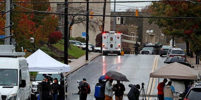 Media tents and vehicles line an intersection near the Tree of Life Synagogue, upper left, where a shooter opened fire Saturday.