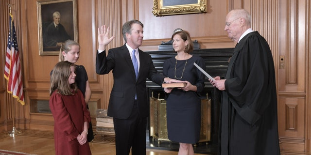 Justice Anthony M. Kennedy, (Retired) administers the Judicial Oath to Judge Brett M. Kavanaugh in the Justices’ Conference Room, Supreme Court Building. Mrs. Ashley Kavanaugh holds the Bible. Credit: Fred Schilling, Collection of the Supreme Court of the United States