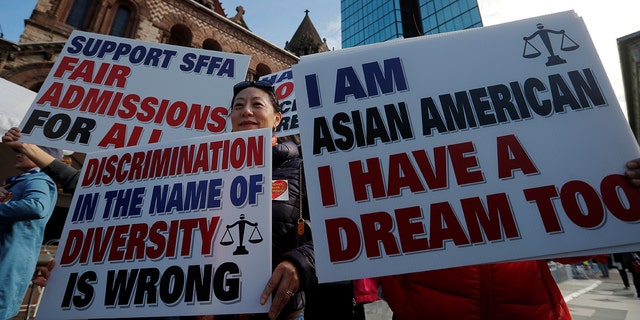 Supporters attend the "Rally for the American Dream - Equal Education Rights for All," ahead of the start of the trial in a lawsuit accusing Harvard University of discriminating against Asian-American applicants, in Boston, Massachusetts, U.S., October 14, 2018. REUTERS/Brian Snyder - RC17E56B19E0