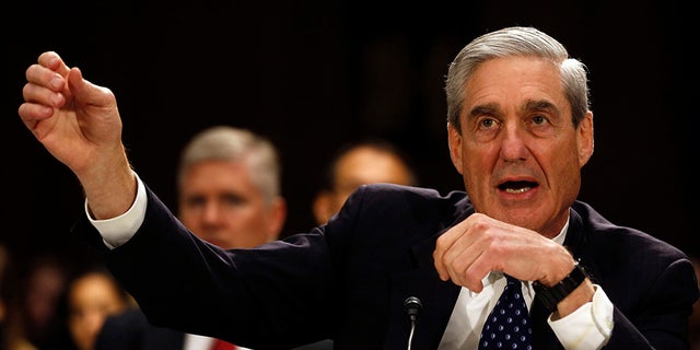 FBI Director Robert Mueller, then the director of the FBI, gestures during a Senate Judiciary Committee hearing on Capitol Hill, June 19, 2013.       