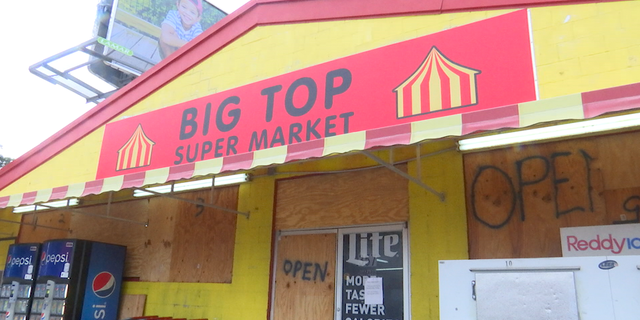 Abbie Shiver continued ringing up customers through Tuesday evening at Big Top Supermarket.