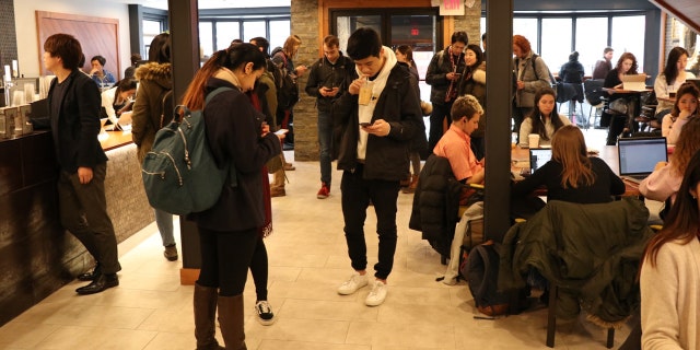 Brown University students at Shiru Cafe, the first location to open in the United States.