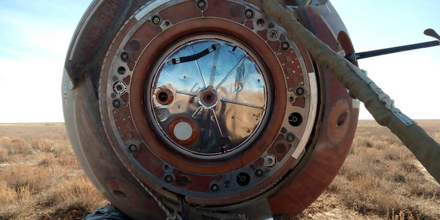 In this photo provided by Russian Defense Ministry Press Service, the Soyuz MS-10 space capsule lays in a field after an emergency landing near Dzhezkazgan, about 450 kilometers (280 miles) northeast of Baikonur, Kazakhstan, Thursday, Oct. 11, 2018. NASA astronaut Nick Hague and Roscosmos' Alexei Ovchinin lifted off as scheduled at 2:40 p.m. (0840 GMT; 4:40 a.m. EDT) Thursday from the Russian-leased Baikonur cosmodrome in Kazakhstan, but their Soyuz booster rocket failed about two minutes after the launch.